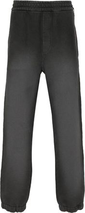 Fendi faded-effect cotton track pants - men - Cotton - 54 - Black