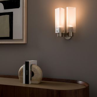 AM.PM Dubbele wandlamp Strozzi, ontwerp Emmanuel Gallina