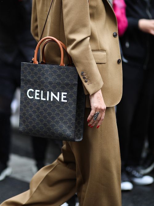 Fashion Week guest wearing a Celine bag on September 29, 2019 in Paris, France.