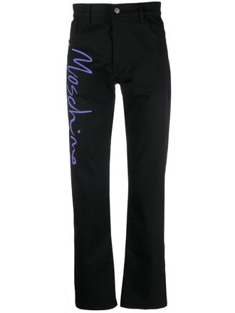 Moschino tailored logo-print trousers - men - Elastane/Cotton - 46 - Black