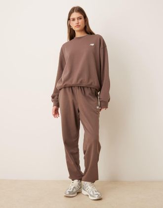 New Balance Sport Essentials - Joggers in french terry marroni-Marrone