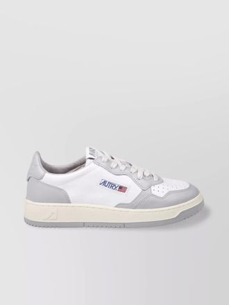 Autry low sneaker with contrast sole and perforated toe