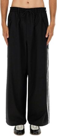 Yohji Yamamoto Loose Black Jogger Pants With Adjustable Drawstring And Striped Details