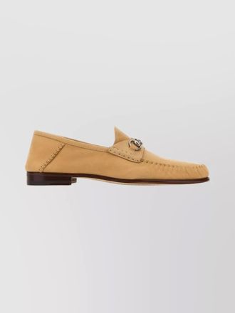 Gucci suede loafers featuring metal hardware