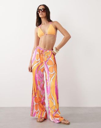 Kulani Kinis Sunrise Swirl - Pantaloni a fondo ampio rosa e arancione
