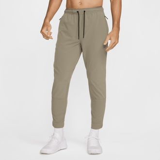 Nike Mens Unlimited Dri-FIT Zippered Cuff Versatile Pants in Green | FB7548-320