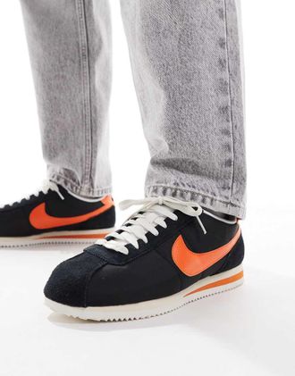 Nike Cortez sneakers in black and orange