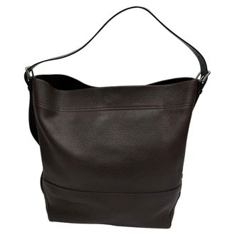 Christophe Lemaire draagtas met riem in bruin rundleer