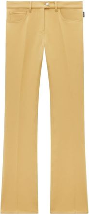 Courrèges low-rise bootcut trousers - women - Polyester/Acetate - 40 - Yellow