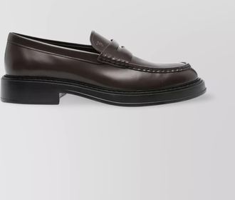 Tod's round toe penny strap loafers in calf leather