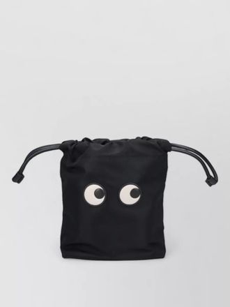 Anya Hindmarch eye motif bucket bag clutch design