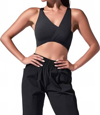 Heroine Sport Twisted Symmetric Neck Top In Black
