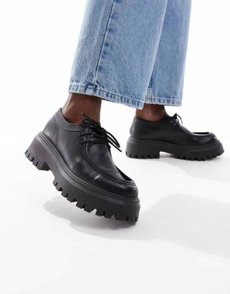 schuh Lyrica - Scarpe stringate in pelle nera con punta a mocassino e suola spessa-Nero