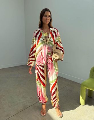 Never Fully Dressed Cirque - Pantaloni cargo con stampa multicolore in coordinato