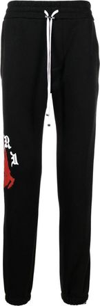 Amiri logo-print track pants - men - Cotton/Lyocell - S - Black