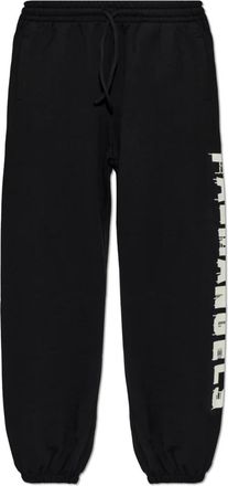 Palm Angels Pantalones de ch&aacute;ndal estampados - Trousers - Hombre - Negro - XL