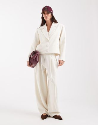 Asos Pantaloni sartoriali a vita bassa extra larghi a palloncino color panna-Bianco