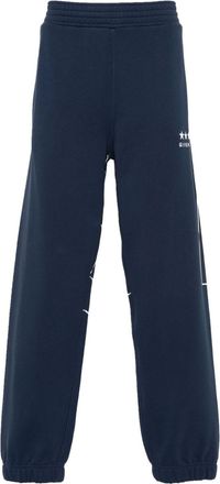 Givenchy logo-print cotton track pants - men - Cotton - M - Blue