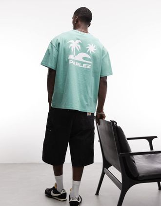 Parlez Clothing T-shirt oversize a maniche corte con mantella verde con stampa di spiaggia sul retro