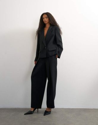 Topshop pantaloni neri a gamba larga con piega frontale-Nero