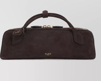 Alaia leather clutch bag