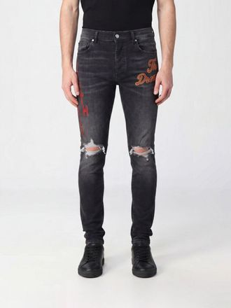 Amiri Jeans skinny South Cali in denim stretch con patch e effetto usurato