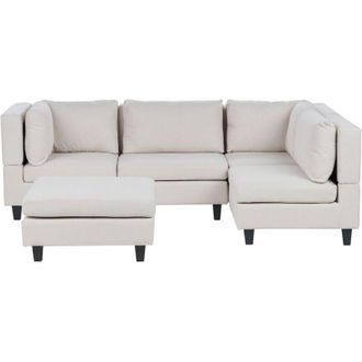 Beliani Divano componibile a 4 posti imbottito in tessuto beige chiaro gambe nere lato sinistro con ottomana Unstad