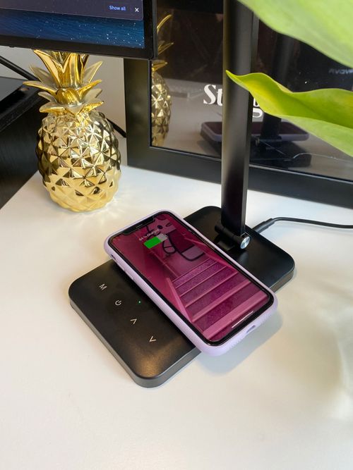 LED desk light with charging component at the base