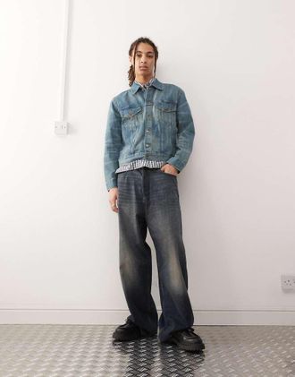 Weekday denim trucker jacket in mid blue wash