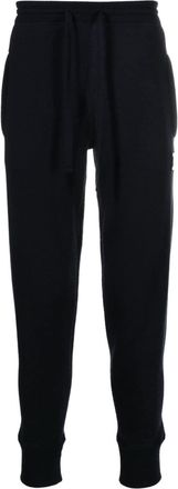 Dolce & Gabbana logo-plaque knitted track pants - men - Virgin Wool/Cashmere - 50 - Blue