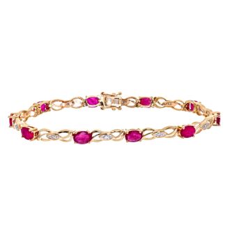 Diamant L'éternel 9ct geelgouden damesarmband met diamant en robijn