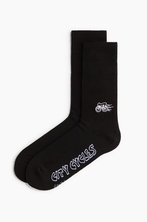 H&M Socken mit Motiv - Schwarz/Keith Haring