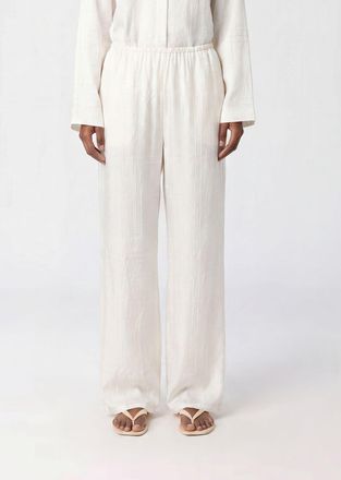 Toteme Pantaloni palazzo in seta con stampa logo e vita alta