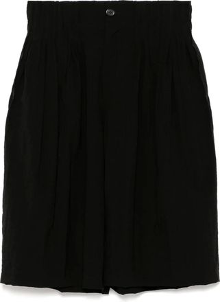 Songzio Shorts a gamba ampia con pince - Nero