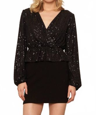 En Cr&egrave;me Long Sleeve Peplum Sequin Top In Black