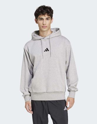 adidas adidas Performance - Essentials Feelcozy - Felpa con cappuccio in pile grigio medio m&egrave;lange / nero