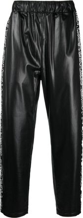 Comme Des Garçons x Keith Haring graphic-print track pants - men - Polyester - M - Black