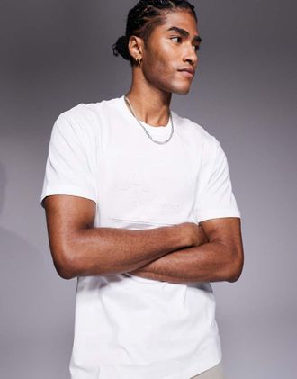 A|X Armani Exchange T-shirt color bianco sporco con logo centrale