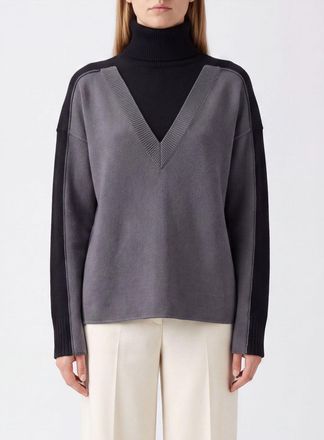 Maison Margiela Dolcevita relaxed fit in lana con motivo bicolor