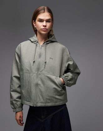 Obey Lula - Giacca da pioggia con cappuccio grigio chiaro