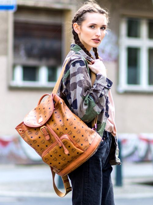 A woman carrying a backpack.