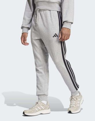 adidas Essential - Pantaloni in French Terry grigio m&eacute;lange medio e nero con 3 strisce