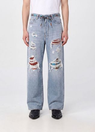 Amiri Jeans wide leg in denim distressed con effetto usurato