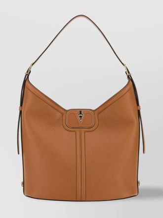 Valentino Garavani leather handbag featuring tassel accents