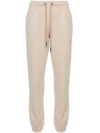 Moncler logo-appliqué track pants - women - Cotton - L - Neutrals