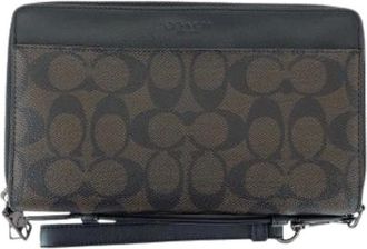 Coach Pre-owned Clutches, male, Brown, Size: ONE SIZE Pre-owned Signature Coated Canvas Long Wallet