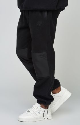 Siksilk Jogger con paneles de forro polar y pu&ntilde;o crudo para hombre SikSilk L