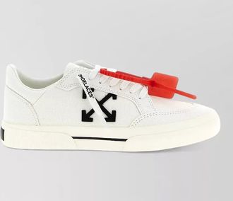 Off-white canvas low-top lace-up sneakers