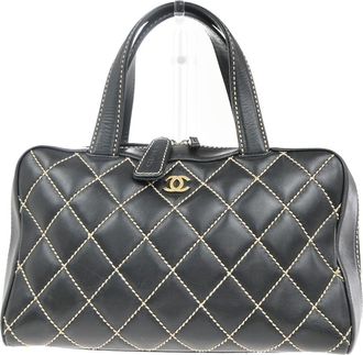 Chanel Surpique Boston Bag Quilted Leather Black Leather Handbag (Pre-Owned)