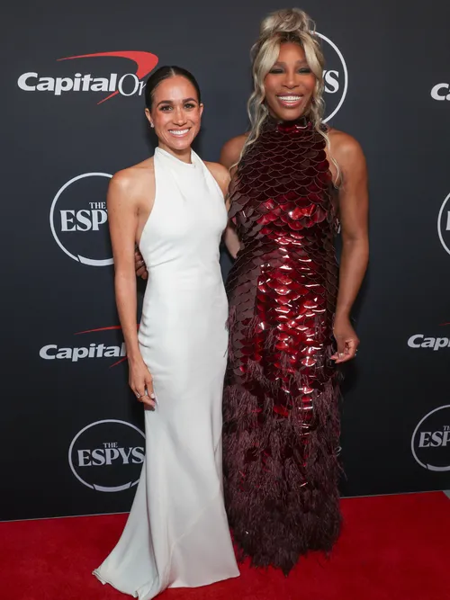 Meghan, Duchess of Sussex and Serena Williams attend the 2024 ESPY Awards at Dolby Theatre on July 11, 2024 in Hollywood, California. Markle is wearing a white halter neck gown from STAUD.